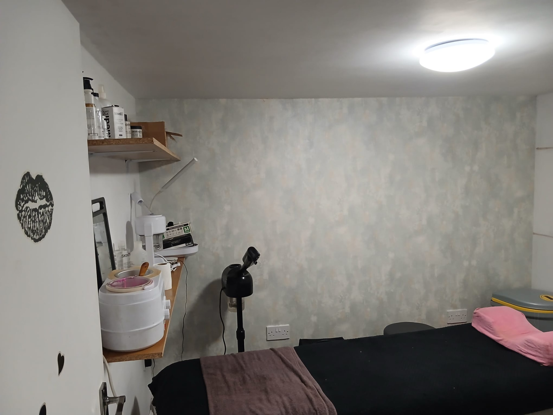 Treatment room with professional product shelving
